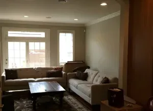 Exterior home painting with updated color and trim accents